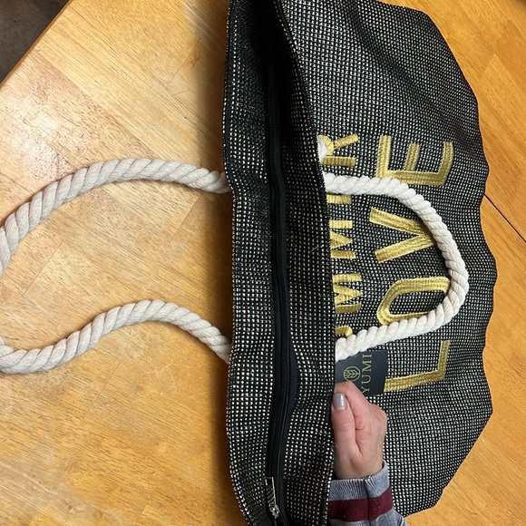 Unused Yumi beach bag w zipper, rope handles. Black metallic w gold lettering. - Picture 2 of 3